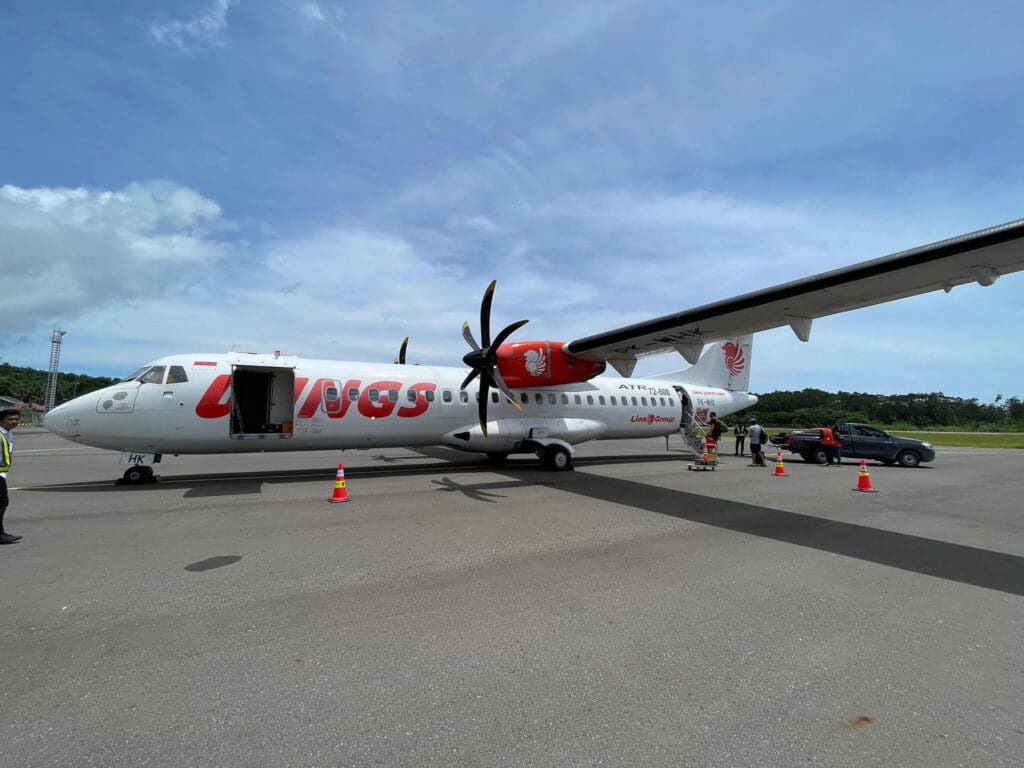 Passengers boarding Wings Air flight from Mentawai to Padang at Rokot Airport with visible aircraft details